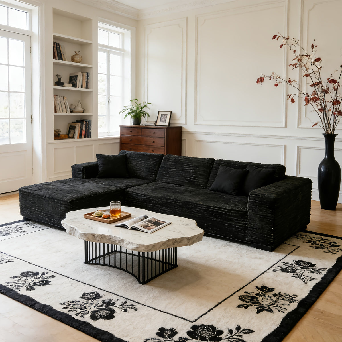 Elegant Contemporary Living Room Setup: Soft Ribbed Fabric Corner Sofa, Light-Filled Interior, And Curated Tabletop Greenery