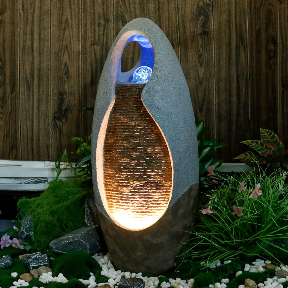 An Indoor Floor Fountain, Standing 27.55 Inches Tall. It's A Home Decor Item, A Large Cobblestone Floor Fountain Ornament, Complete with A Glass Ball And Lighting Features.