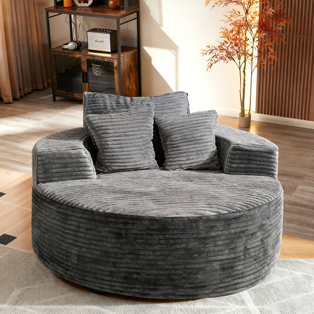 Elegant Contemporary Living Room Setup: Soft Ribbed Fabric Corner Sofa, Light-Filled Interior, And Curated Tabletop Greenery