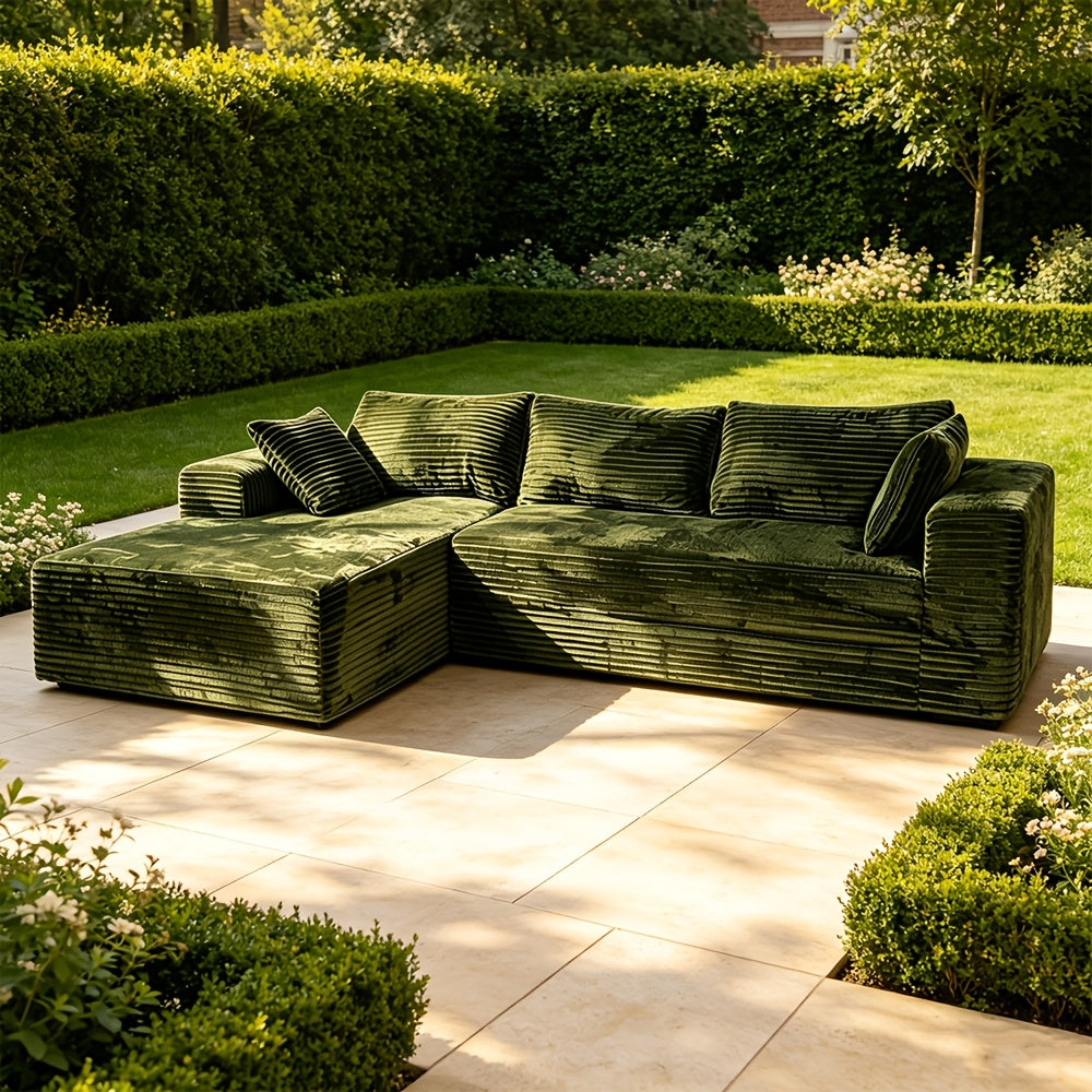 Elegant Contemporary Living Room Setup: Soft Ribbed Fabric Corner Sofa, Light-Filled Interior, And Curated Tabletop Greenery