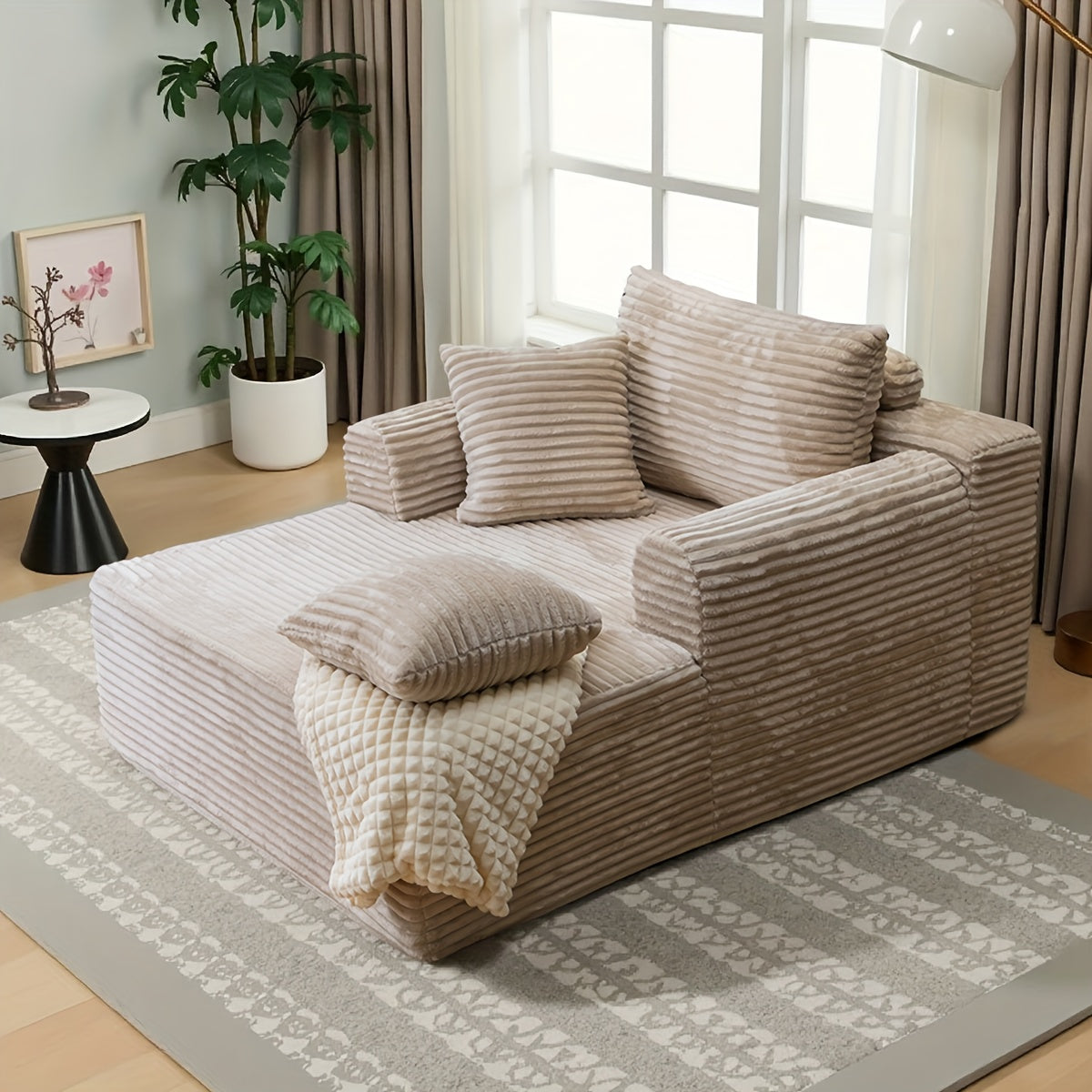 A Modern Fabric Corduroy Sofa Bed with a Deep Seat That Can Be Converted, Featuring Throw Pillows And Cloud-Shaped Armrests, Along with Storage Pockets, Ideal for Use As a Reclining Sofa in Living Rooms, Bedrooms, Apartments, And Offices