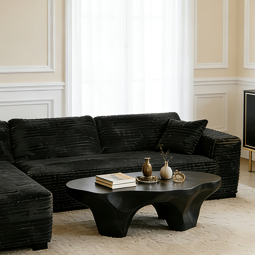 Elegant Contemporary Living Room Setup: Soft Ribbed Fabric Corner Sofa, Light-Filled Interior, And Curated Tabletop Greenery