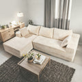 Elegant Contemporary Living Room Setup: Soft Ribbed Fabric Corner Sofa, Light-Filled Interior, And Curated Tabletop Greenery