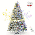 9ft Prelit Snow Flocked Artificial Christmas Tree with Multifunctional Remote, 8 Lighting Modes and 10 Brightness Musical Xmas Tree with Auto-Off Timer, 360 Degree Rotating Base Christmas Tree for Holiday Decorations